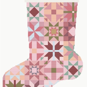May include: A Christmas stocking with a patchwork design in shades of pink, burgundy, and green. The word "GRACE" is stitched across the top. The stocking features geometric star and square patterns.