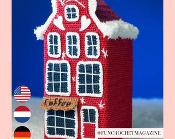 May include: A handmade red crochet house with white trim, windows, and a sign that says "Coffee." The roof is a darker red with white trim. The house is decorated with white stars and hearts. The background is a gradient of blue.
