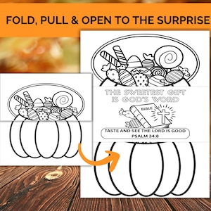 May include: Black and white line art of a pumpkin-shaped card with a candy-filled oval above it. The card opens to reveal the text "THE SWEETEST GIFT IS GOD'S WORD" and "TASTE AND SEE THE LORD IS GOOD PSALM 34:8". The card is on a wooden surface.