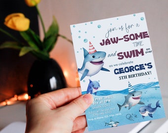 May include: A birthday invitation featuring cartoon sharks in a watercolor style. The invitation reads "Join us for a JAW-SOME TIME and SWIM" and celebrates George's 5th birthday. The invitation includes date, time, and location details.