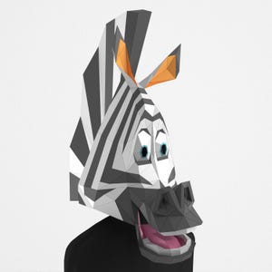 Könnte beinhalten: 3D-Darstellung eines Zebra-Kopfes mit schwarz-weißem Streifenmuster. Das Zebra hat blaue Augen, orange Ohren und eine rosa Zunge. Das Zebra lächelt und wirkt wie eine Cartoon-Figur.
