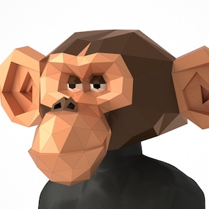 May include: A brown and orange 3D papercraft monkey head with a black background. The monkey has a serious expression and is looking to the left.