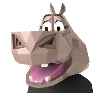 Può includere: Una testa di ippopotamo di cartone animato marrone e rosa con una bocca spalancata e occhi grandi. L'ippopotamo è fatto di carta e ha un effetto 3D.