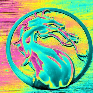 May include: A teal blue dragon logo with a pink outline, set against a yellow and blue background. The dragon is in a circle with a black outline.