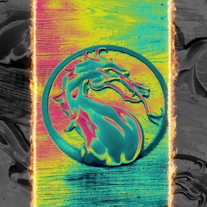 May include: A fiery orange and yellow frame surrounds a green, yellow, and pink dragon logo on a wooden background.