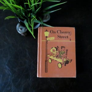 Vintage Grundschulbuch 'On Cherry STreet' 1953 von Ginn and Company Odille Ousley und David H Russel The Ginn Basic 1st Reader