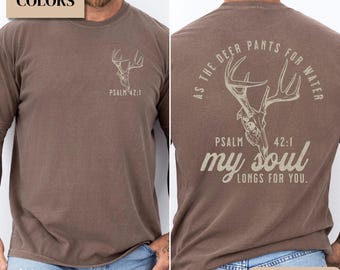 May include: Espresso-colored long-sleeve t-shirt with a deer skull graphic. The front of the shirt has a small deer skull design and the text "PSALM 42:1". The back of the shirt features a larger deer skull design with the text "AS THE DEER PANTS FOR WATER, PSALM 42:1, my soul LONGS FOR YOU."