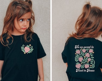 May include: Black t-shirt with a strawberry graphic on the front and the text "'Tis so sweet to trust in Jesus" with strawberries on the back.
