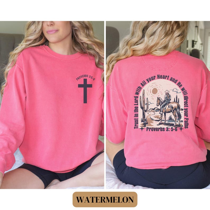 May include: Watermelon pink sweatshirt with a black cross and the text "PROVERBS 3:5-6" on the front. The back of the sweatshirt has a graphic of a cowboy riding a horse with the text "Trust in the Lord with All your Heart and He will direct your Paths Proverbs 3:5-6".