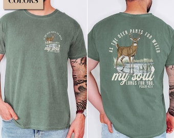 May include: A moss green t-shirt with a deer graphic and the text "As the deer pants for water, my soul longs for you. Psalm 42:1." The shirt has a crew neck and short sleeves. The shirt is made of a soft, comfortable material.