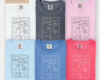 May include: Six different color t-shirts with a graphic design of a palm tree, seashells, and flip-flops. The text on the shirts reads "Johnson Family Vacay Destin, FL 2025".