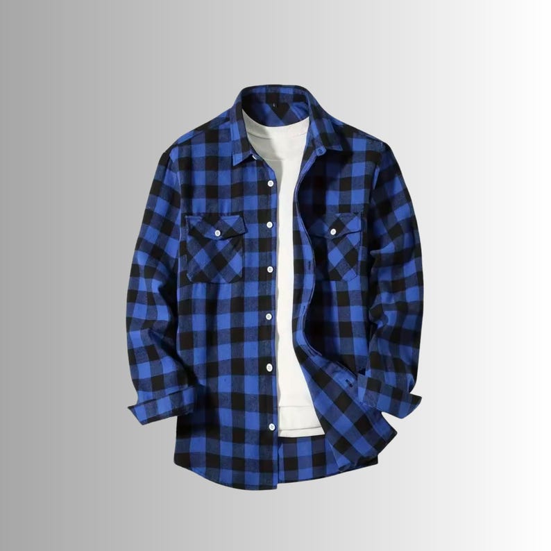 May include: Blue and black plaid flannel shirt with two chest pockets and button-down closure. The long-sleeved shirt is layered over a white t-shirt. The shirt is a classic casual style.