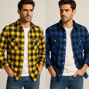 May include: Two plaid button-down shirts, one yellow and black, the other blue and black. Both shirts have two chest pockets and are worn over a white t-shirt and blue jeans. The shirts are long-sleeved.