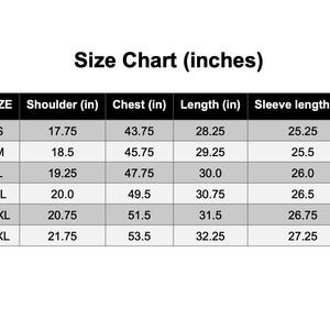 May include: A size chart in inches for clothing, with measurements for shoulder, chest, length, and sleeve length. Sizes range from S to 3XL, with corresponding measurements in inches.