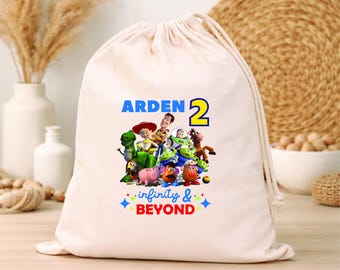 Bomboniere personalizzate a tema Toy Story per feste di compleanno per bambini: sacchetti con coulisse e sacchetti in cotone personalizzati con il nome.