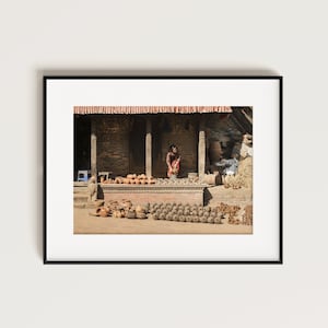 Street professional photo – Woman Selling traditional handmade pottery in Bhaktapur, Nepal
