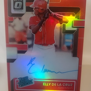Reimpresión de la tarjeta de béisbol novedosa de la MLB con calificación Optic Rookie Auto de Elly De La Cruz 2022 de Donruss