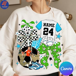 May include: White sweatshirt with a soccer-themed design. Features a soccer ball, jersey with "NAME 24", and a photo of a child playing soccer. Includes bows, stars, and soccer ball graphics. The word "Canva" is visible.