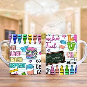 May include: White ceramic mug with a colorful design featuring crayons, books, and the words "Eat Sleep Teach Repeat" and "Teacher Fuel". The mug also has a chalkboard that says "Best Teacher Ever".