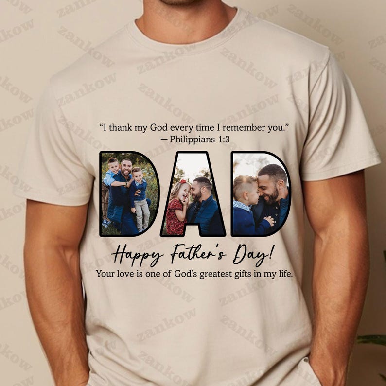 May include: Beige t-shirt with the word "DAD" in black, each letter filled with a family photo. The shirt also features the text "Happy Father's Day!" and a Bible verse. A personalized gift for Father's Day.