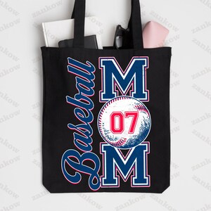 May include: Black canvas tote bag with a white baseball and the text "Baseball Mom" in blue and red. The baseball has the number "07" in red.