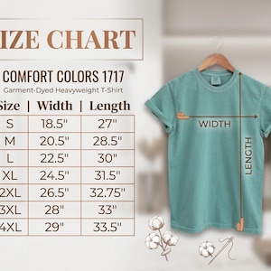 May include: A size chart for a Comfort Colors 1717 garment-dyed heavyweight t-shirt. The chart lists sizes S through 4XL with corresponding width and length measurements in inches. A teal t-shirt is shown with arrows indicating width and length.