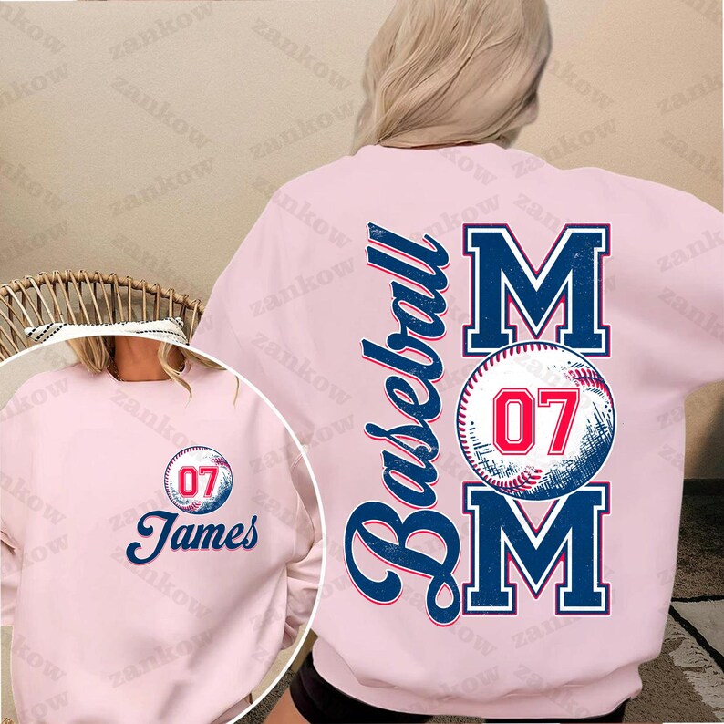 May include: Pink baseball mom sweatshirt with a baseball graphic and the text "Baseball Mom" and "07". A smaller pink sweatshirt with the text "James" and "07" is also shown.