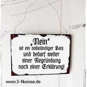 Könnte beinhalten: Ein weißes Metallschild mit roten Rändern und schwarzem Text, auf dem "Nein" steht, ist ein vollständiger Satz und bedarf weder einer Begründung noch einer Erklärung. Das Schild hängt an einem Draht und hat die Website www.3-Nuesse.de unten aufgedruckt.