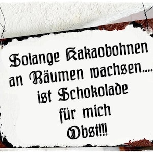 Può includere: Un cartello bianco con testo nero che dice "Solange Kakaobohnen an Bäumen wachsen... ist Schokolade für mich Obst!!!"