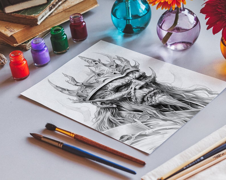 May include: A black and white drawing of a king with a large crown and a long beard. The drawing is on a white sheet of paper and is surrounded by paintbrushes and paint jars.