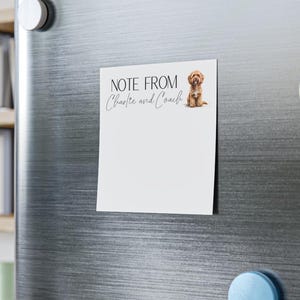 May include: A square white magnetic notepad featuring the black printed text NOTE FROM and the cursive text Charlie and Coach, accompanied by a small illustration of a brown curly-haired dog sitting on the right side of the header.