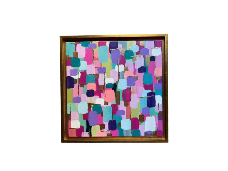 Peut inclure: Peinture abstraite encadr&eacute;e d'or. L'&oelig;uvre pr&eacute;sente une composition color&eacute;e de formes rectangulaires dans des tons de rose, de violet, de turquoise et de vert, avec des touches dor&eacute;es. La peinture est de forme carr&eacute;e.