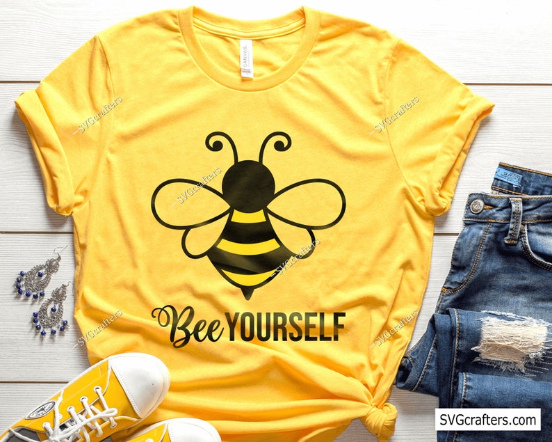 May include: Yellow t-shirt with a black and yellow bee graphic and the text "Bee Yourself".