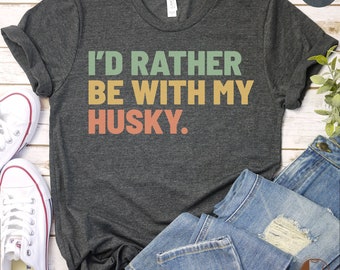 May include: Dark grey heather t-shirt with the text "I'd rather be with my husky." in a retro font with green, orange, and pink colors.