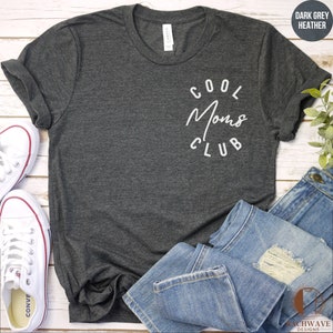 May include: A dark grey heather t-shirt with the text "Cool Moms Club" in white lettering on the front.