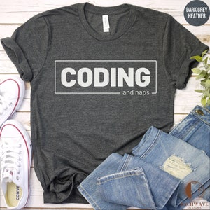 May include: Dark grey heather t-shirt with white text that reads "CODING and naps".