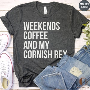 May include: Dark grey heather t-shirt with white text that reads "Weekends Coffee And My Cornish Rex".