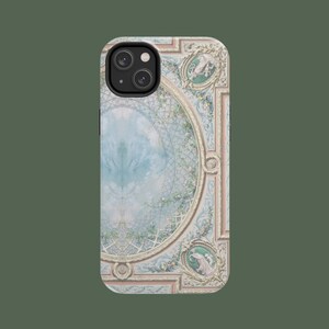 May include: A phone case with a decorative design featuring a blue and white ceiling with ornate gold trim. The design includes floral details and a central circular motif.