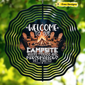 May include: Black metal wind spinner with a campfire scene and the text "Welcome to our Campsite where friends and marshmallows get toasted".
