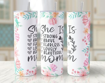May include: Three stainless steel tumblers with floral designs and the text "She Is Strong Brave Fearless Lovely Beautiful Mom" on a white background.