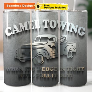 May include: A gray and silver tumbler with a graphic of a vintage tow truck with a camel on the side. The text "CAMEL TOWING" is at the top of the tumbler and the text "WHEN ITS WEDGE IN TIGHT WE'LL PULL IT OUT!" is at the bottom.