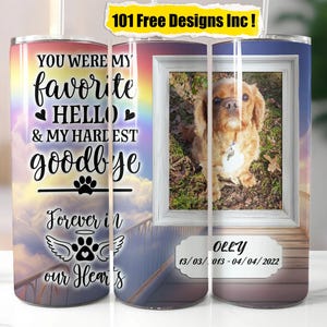 May include: A rainbow-colored stainless steel tumbler with a white paw print and the text "You were my favorite hello & my hardest goodbye Forever in our hearts". The tumbler has a photo of a golden retriever dog in a window with the text "Oley 13/03/013-04/04/2022".