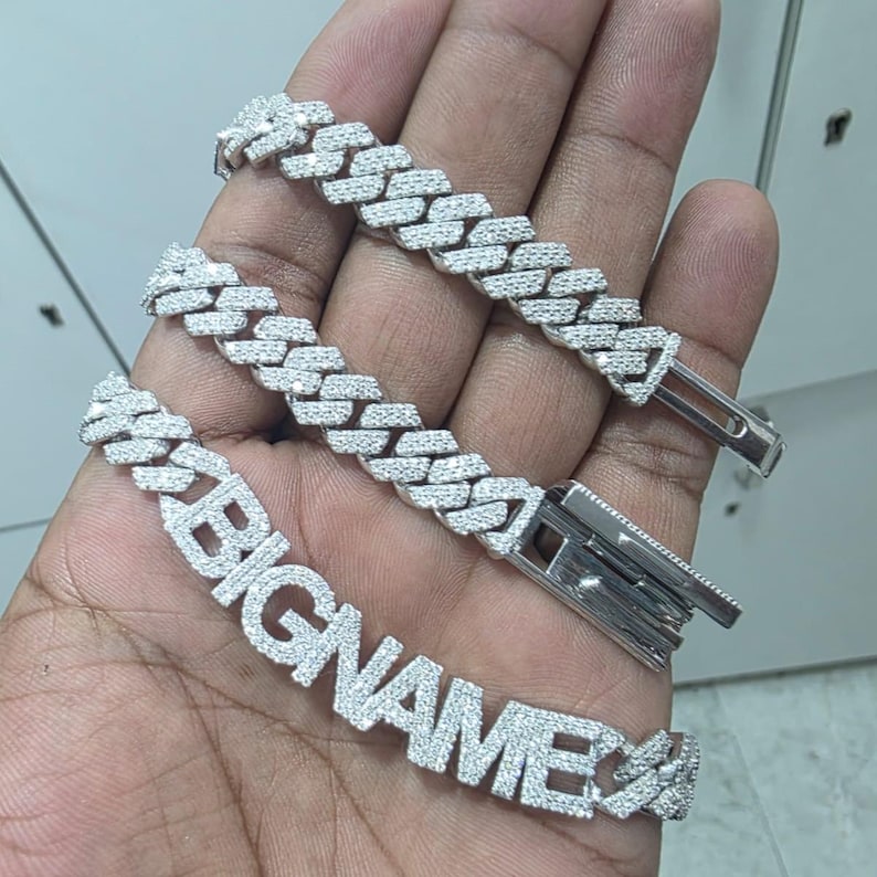 May include: A set of three ceramic vases in varying heights and shapes. The vases are glazed in a matte white finish, offering a minimalist aesthetic. The tallest vase is approximately 10 inches high.