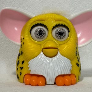 Furby 1998 Plastic McDonald's Happy Meal Toy, 3" Yellow w/ Black Leopard Spots White Hair Grey Eyes, Eyes Ears Mouth & Feet Move, Pre-Owned