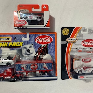 Lot - 9 Matchbox Collectibles Coca Cola Vehicles with Display Stands
