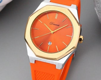 Uhr mit orangefarbenem und goldenem Zifferblatt und orangefarbenem Kautschukarmband