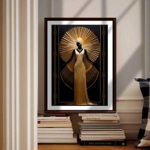 May include: Art Deco style framed print featuring a woman in a gold gown with a sunburst halo. The artwork has a black background with gold geometric accents. The print is displayed on a wall above a stack of books.