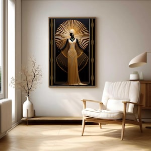 May include: Art Deco style framed print featuring a gold-colored figure with a sunburst halo against a black background. The figure wears a long, flowing gown. The frame has gold and black geometric details. The artwork is displayed in a well-lit room.