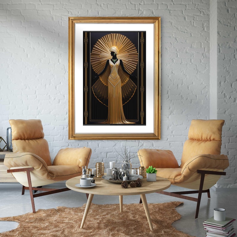 May include: A framed art print featuring a gold and black Art Deco design. The artwork depicts a stylized figure in a gold gown with a sunburst halo. The print is displayed in a gold frame, adding to the luxurious aesthetic. The room includes two tan armchairs and a wooden coffee table.