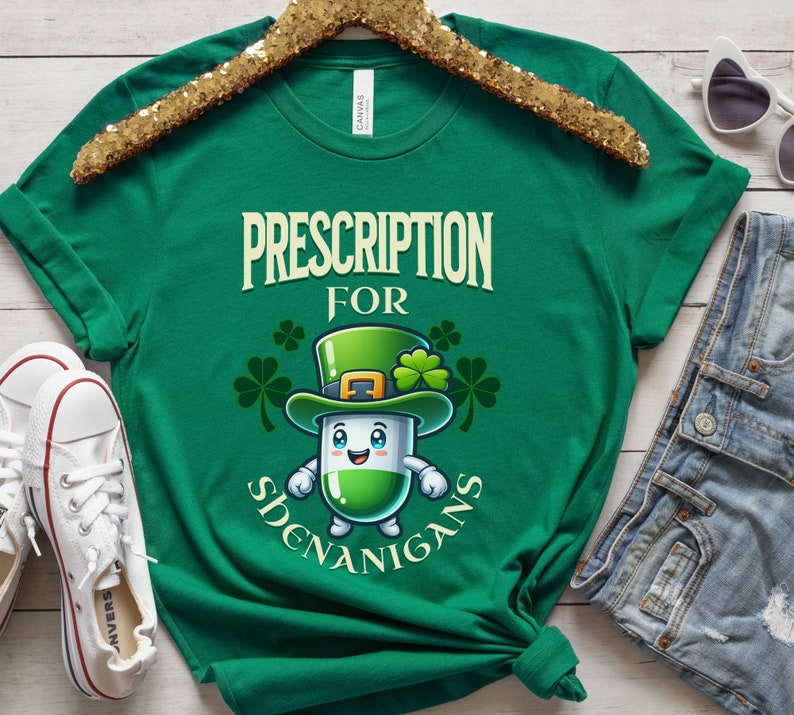 May include: Green t-shirt with a cartoon pill wearing a leprechaun hat and the text "Prescription for Shenanigans".